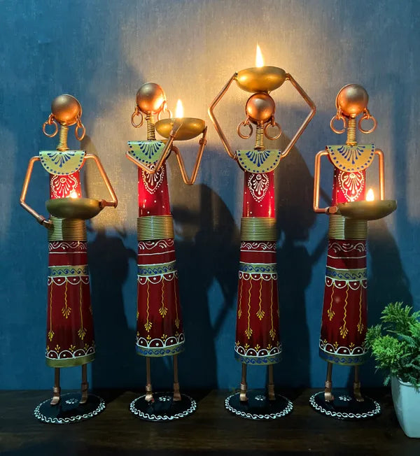 Multicolour Metal Doll Showpieces – four figures holding lit tea lights