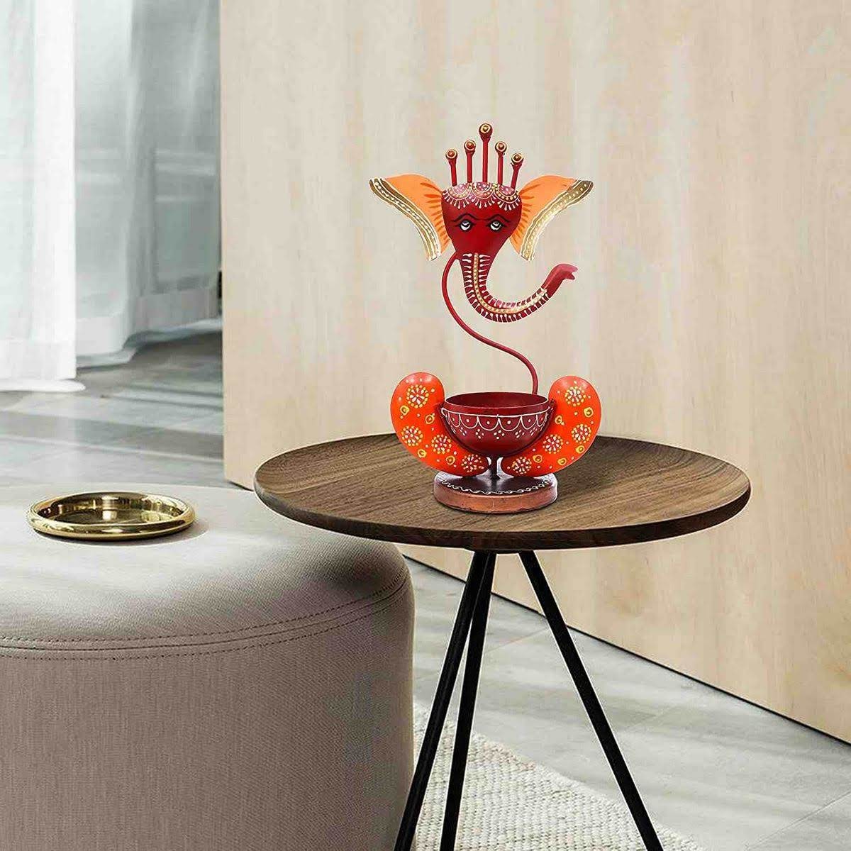 Multicolour Ganesha Tea Light Holder – red Ganesha holder displayed on a table
