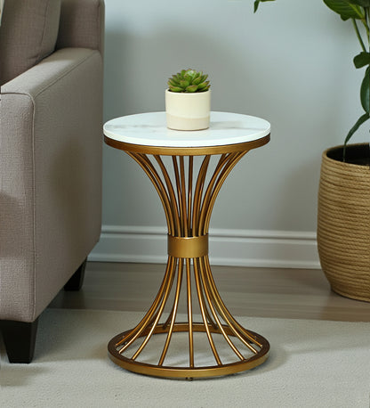 Infinity Oval-Ring Marble Side Table – gold oval-ring frame beside an armchair