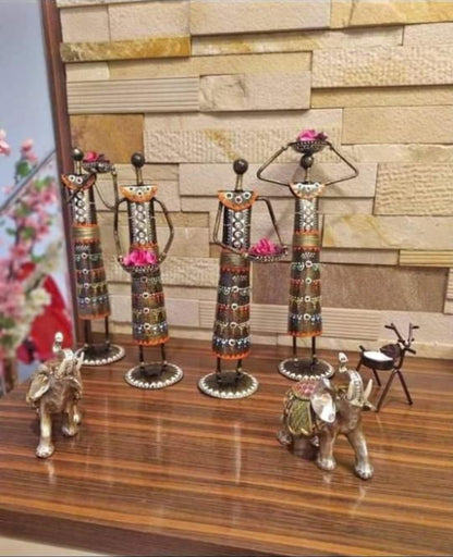 Multicolour Metal Doll Showpieces – four standing figures displayed together