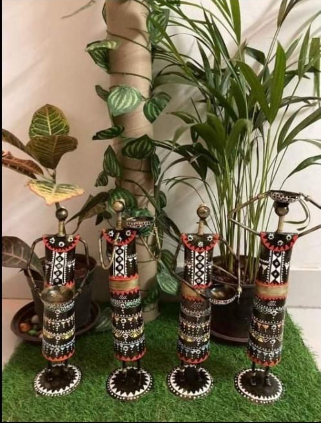 Multicolour Metal Doll Showpieces – figures arranged with plants