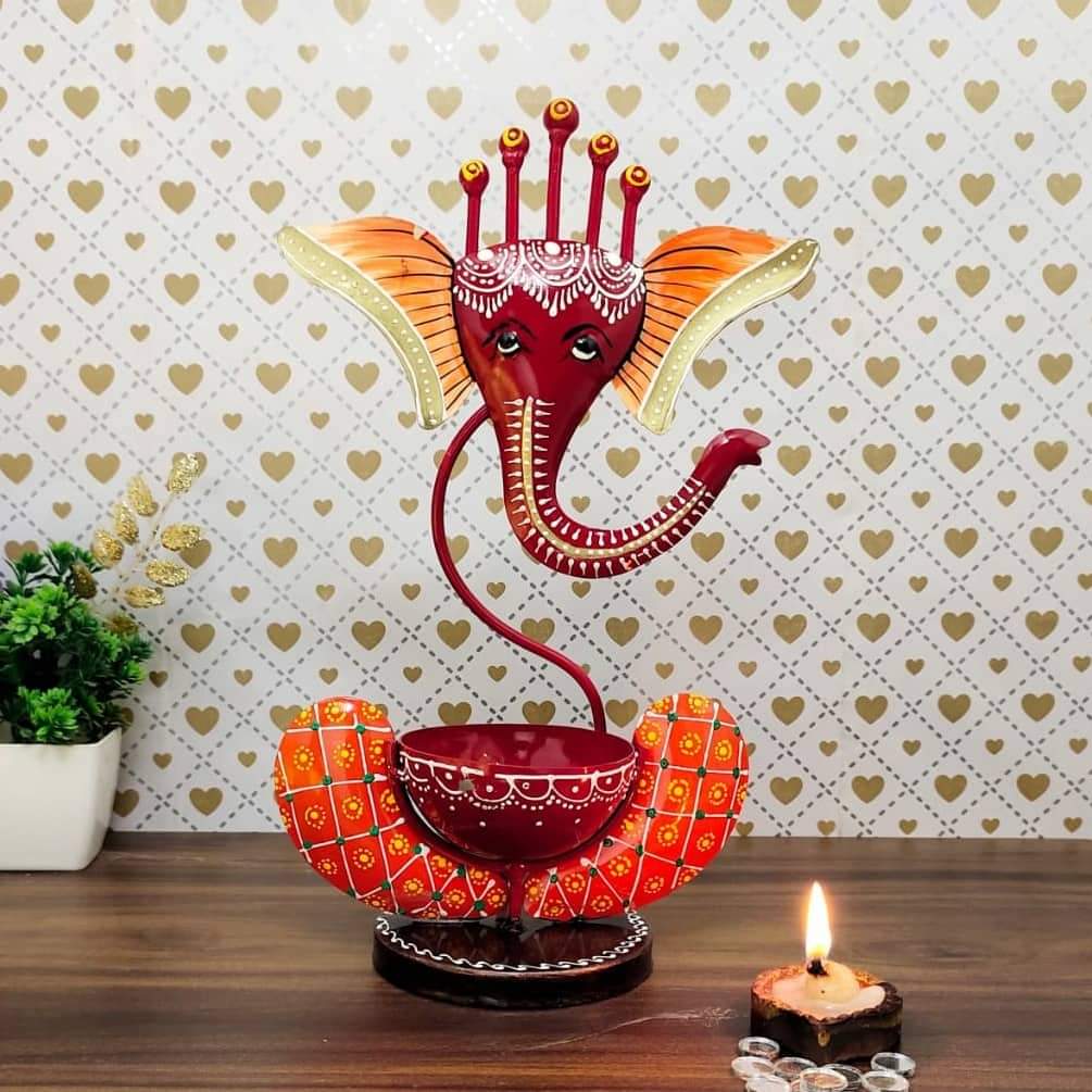 Multicolour Ganesha Tea Light Holder – red Ganesha holder in a styled setting