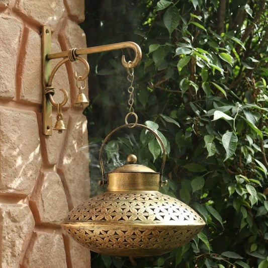 Gold Wall Décor Tea Light Holder – lantern displayed outdoors near a plant