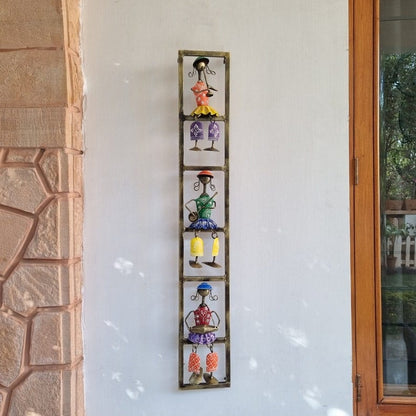 Iron Doll Musician Wall Art, Set of 3 – vertical framed musicians beside a stone wall